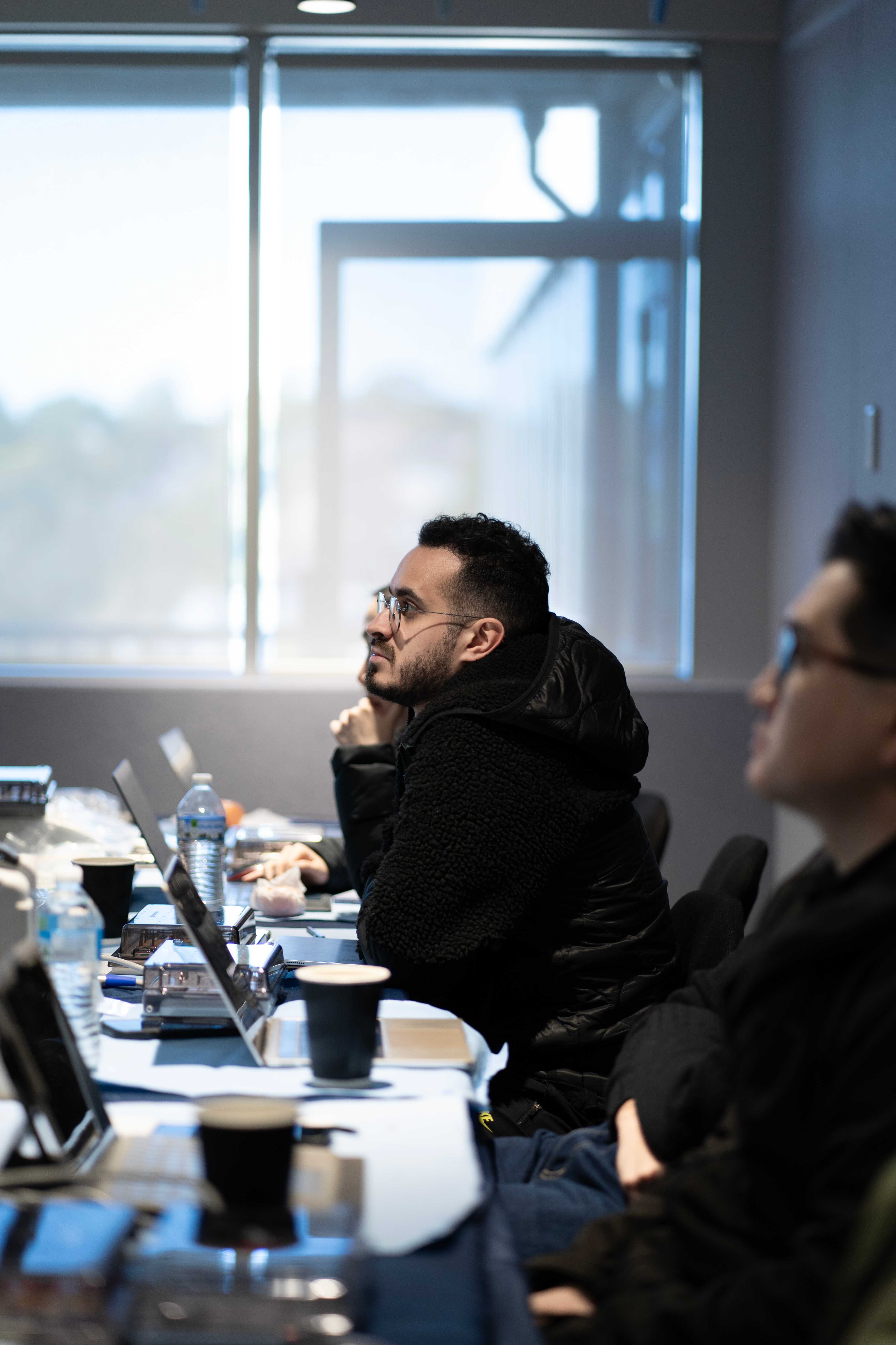 Graduate dentist listening during seminar